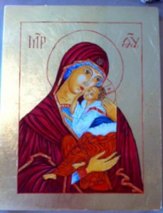 Szűz Mária édesanyja ölében